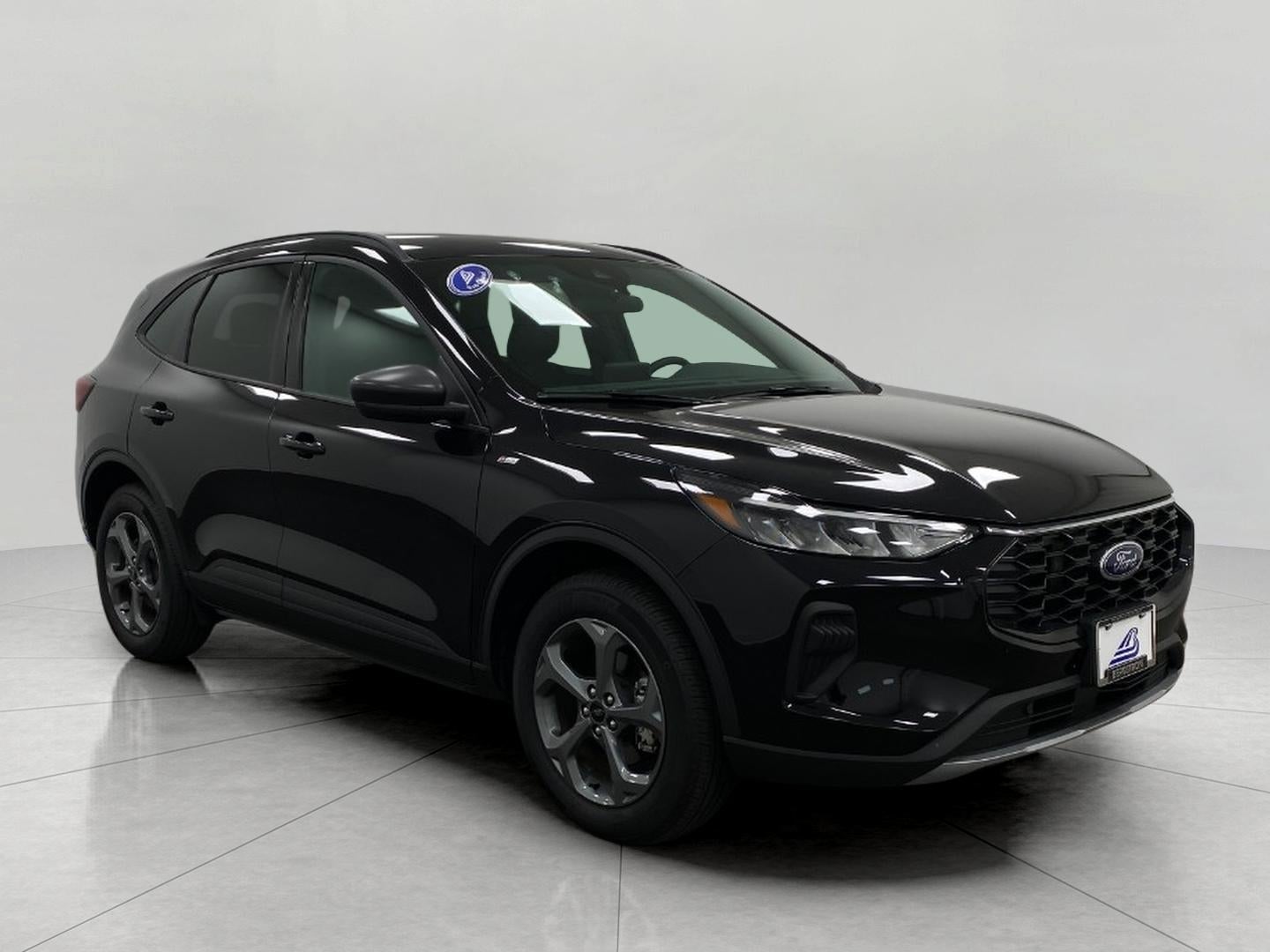 2025 Ford Escape ST-Line AWD in Agate Black Metallic — front three-quarter view