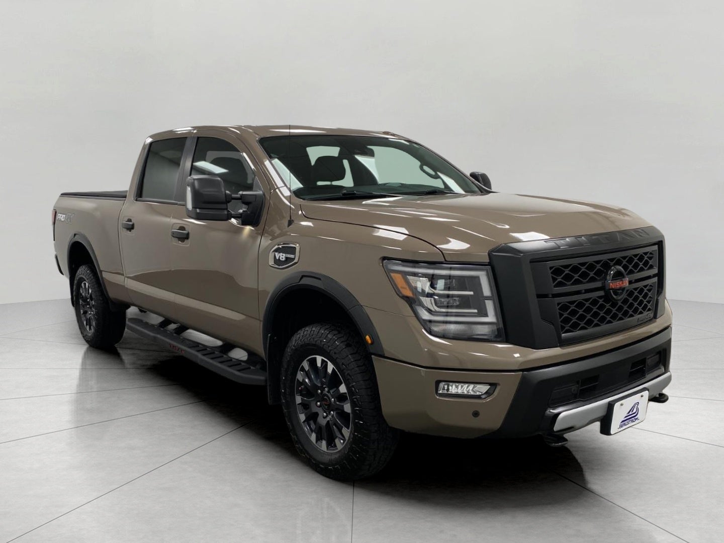 2021 Nissan Titan XD 4x4 Crew Cab PRO-4X in Baja Storm — front three-quarter view