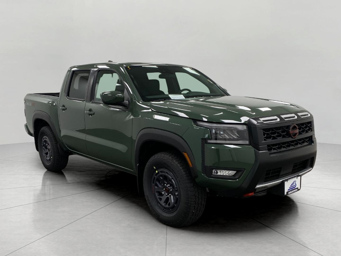 2026 Nissan Frontier Crew Cab PRO-4X in Tactical Green Metallic — front three-quarter view