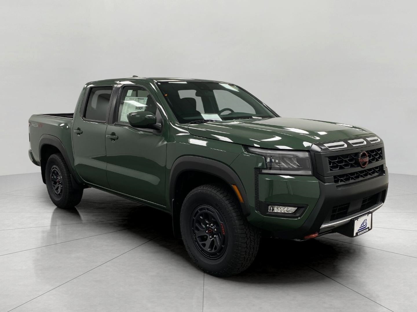 2026 Nissan Frontier Crew Cab PRO-4X in Tactical Green Metallic — front three-quarter view