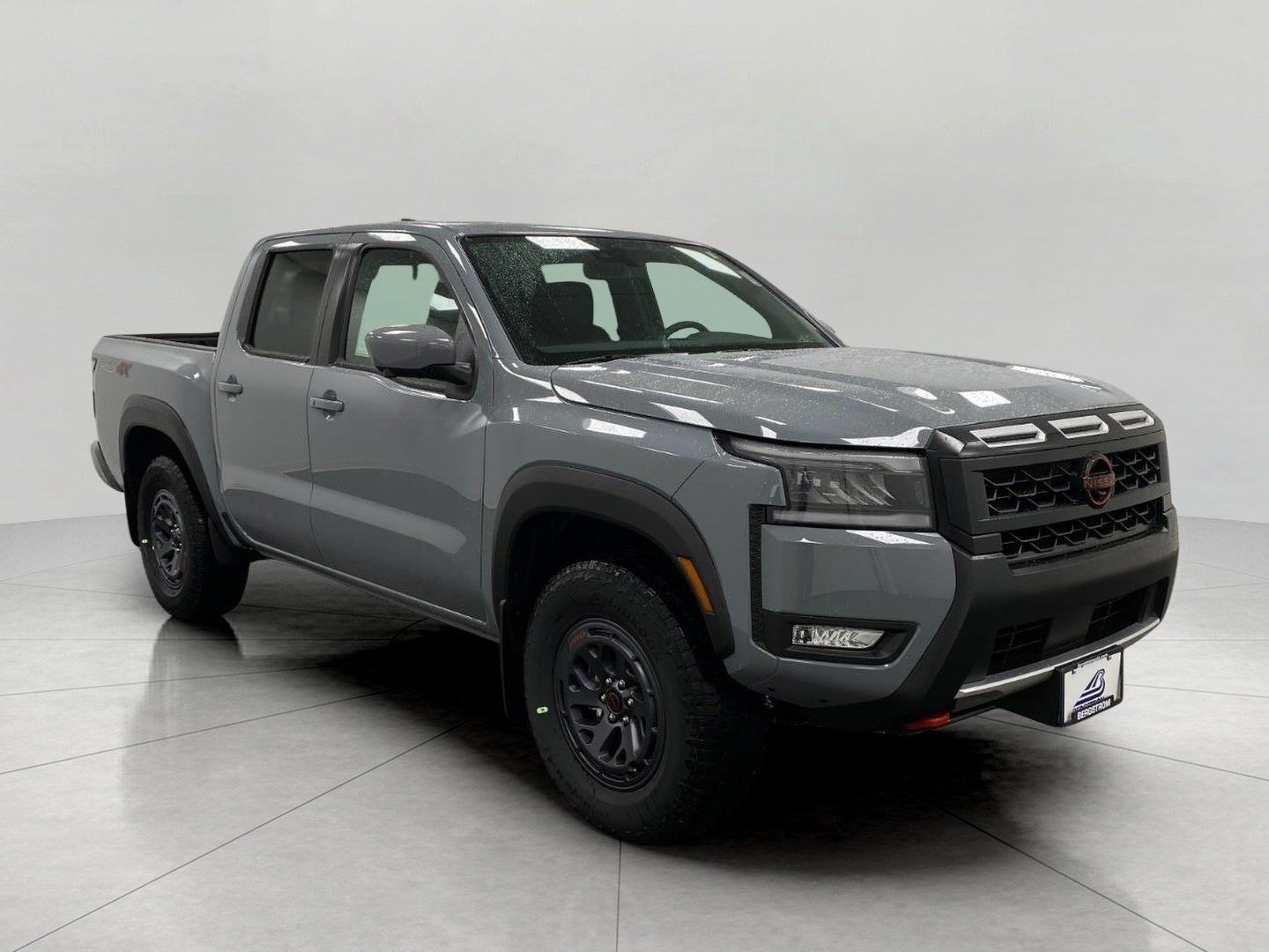 2026 Nissan Frontier Crew Cab PRO-4X in Boulder Gray Pearl — front three-quarter view