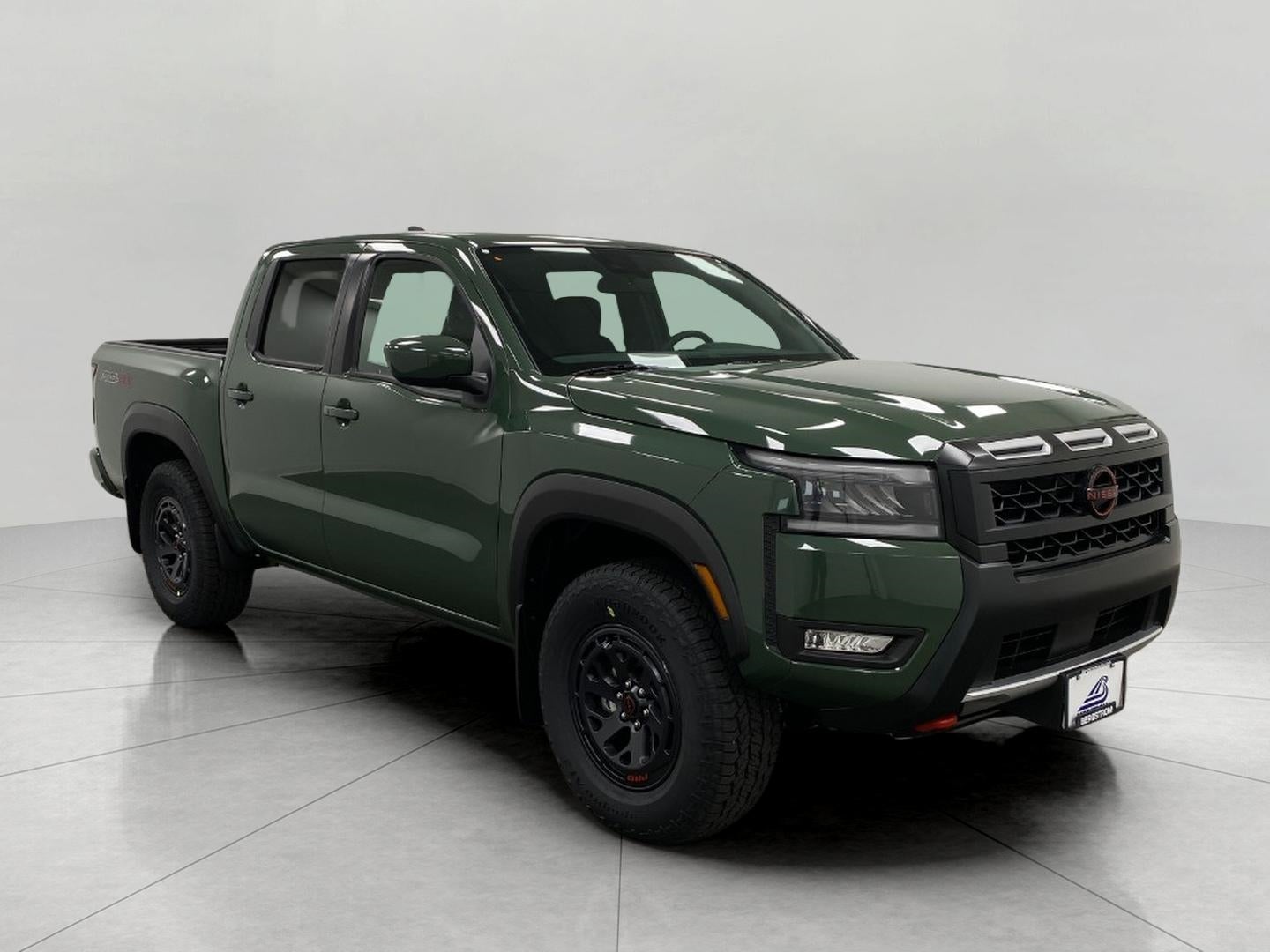 2026 Nissan Frontier Crew Cab PRO-4X in Tactical Green Metallic — front three-quarter view