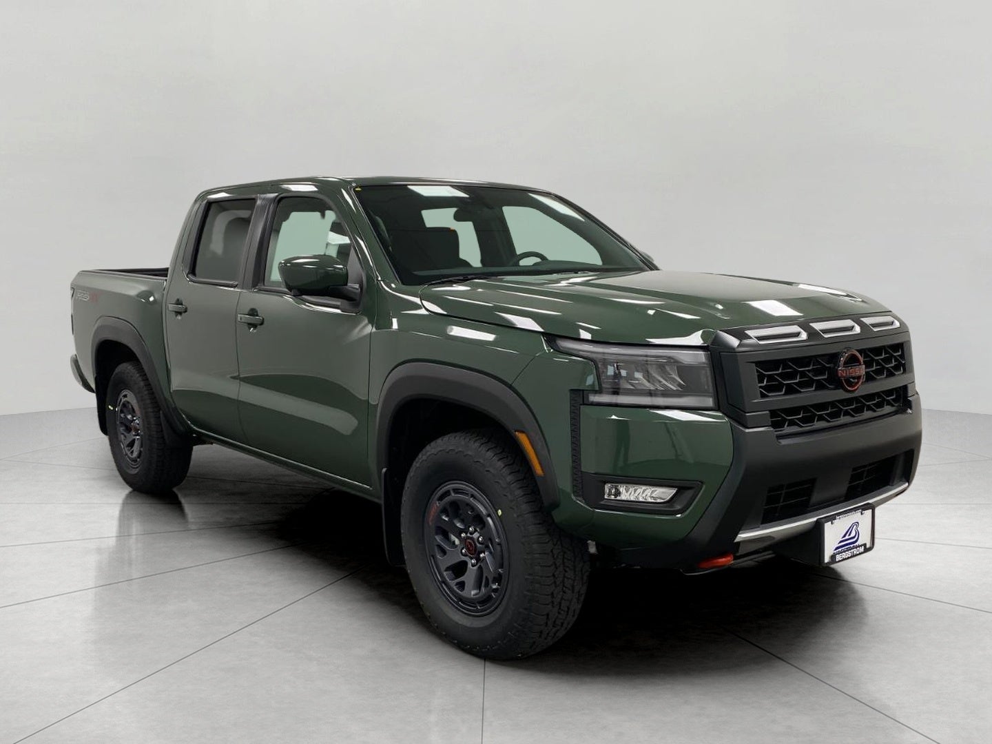 2026 Nissan Frontier Crew Cab PRO-4X in Tactical Green Metallic — front three-quarter view