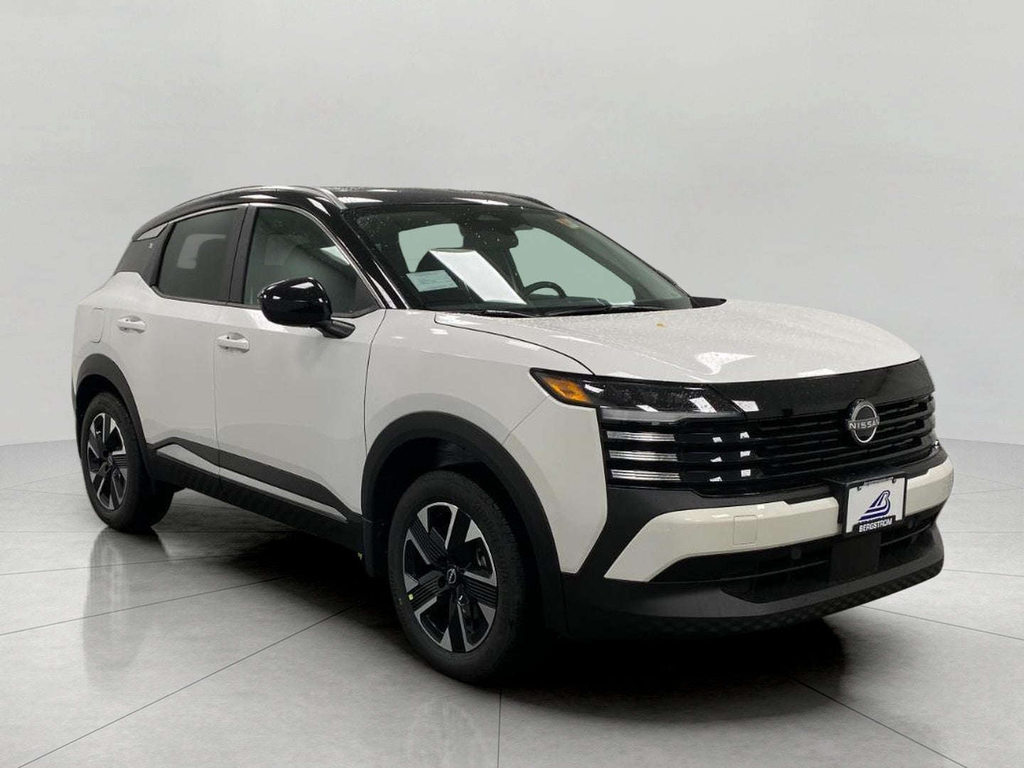 2026 Nissan Kicks SV in Aspen White Tricoat Super Black Two Tone — front three-quarter view