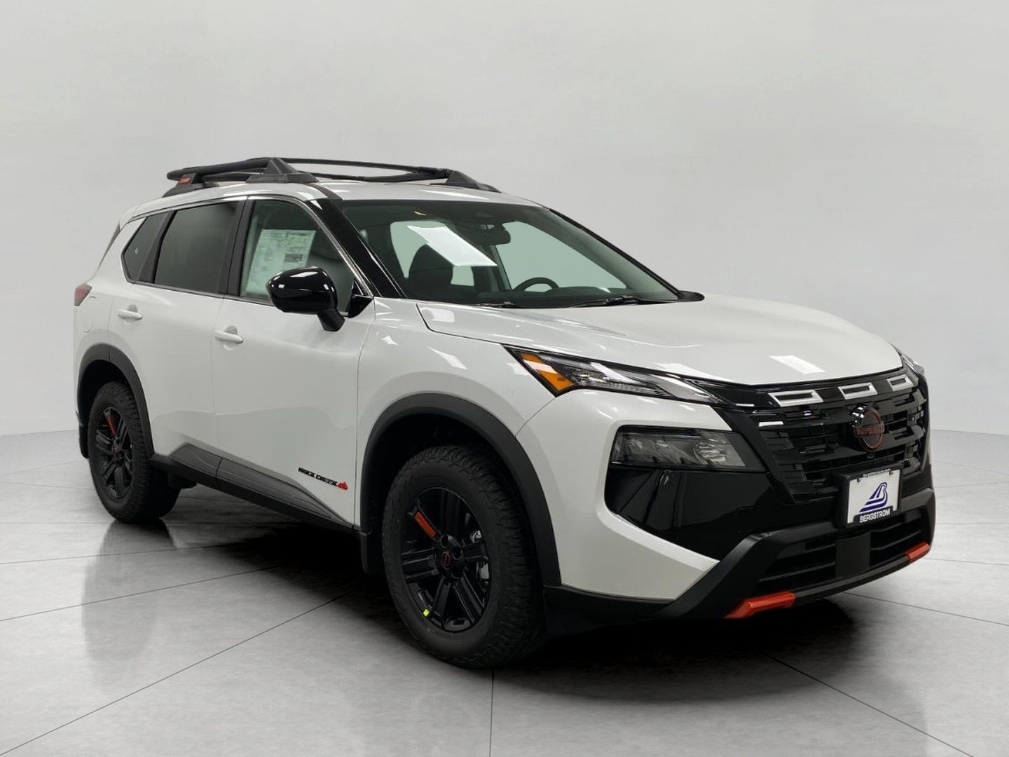 2026 Nissan Rogue Rock Creek in Everest White Pearl Tricoat — front three-quarter view
