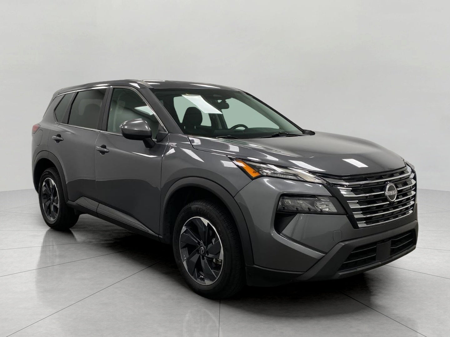 2025 Nissan Rogue SV in Gun Metallic — front three-quarter view