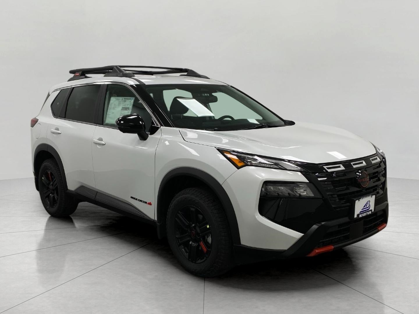 2026 Nissan Rogue Rock Creek in Everest White Pearl Tricoat — front three-quarter view
