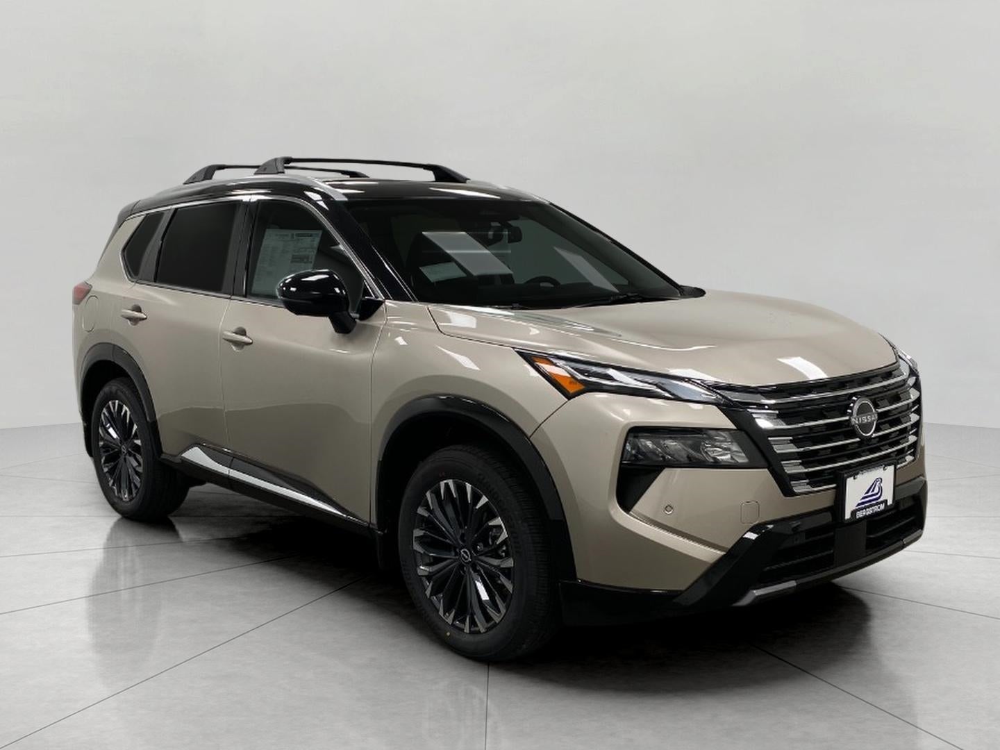 2026 Nissan Rogue Platinum in Champagne Silver Metallic Super Black Two Tone — front three-quarter view